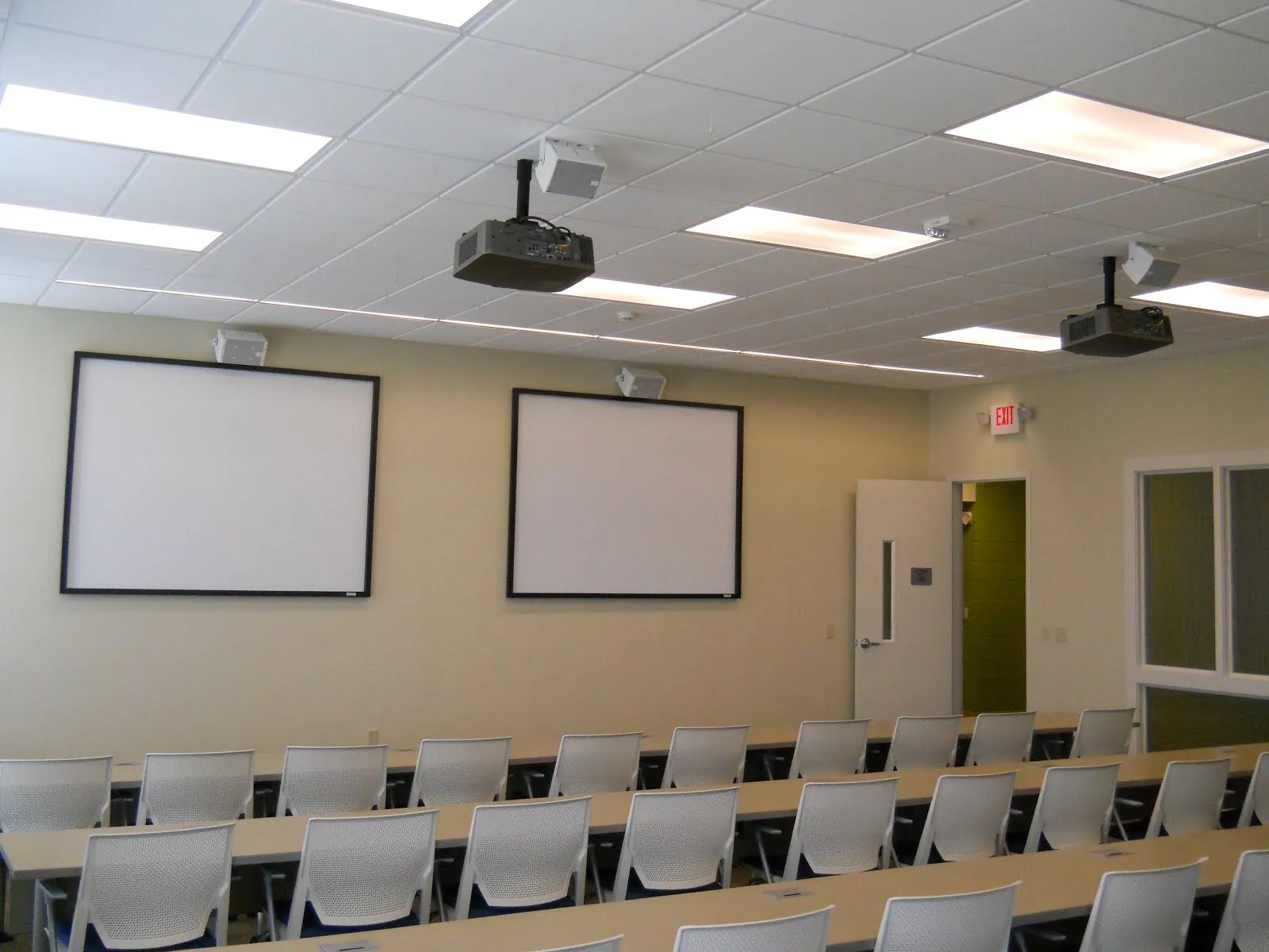 Twin screens with separate projectors, training facility