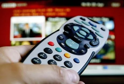 Universal remote control programmed to operate a full audio visual system