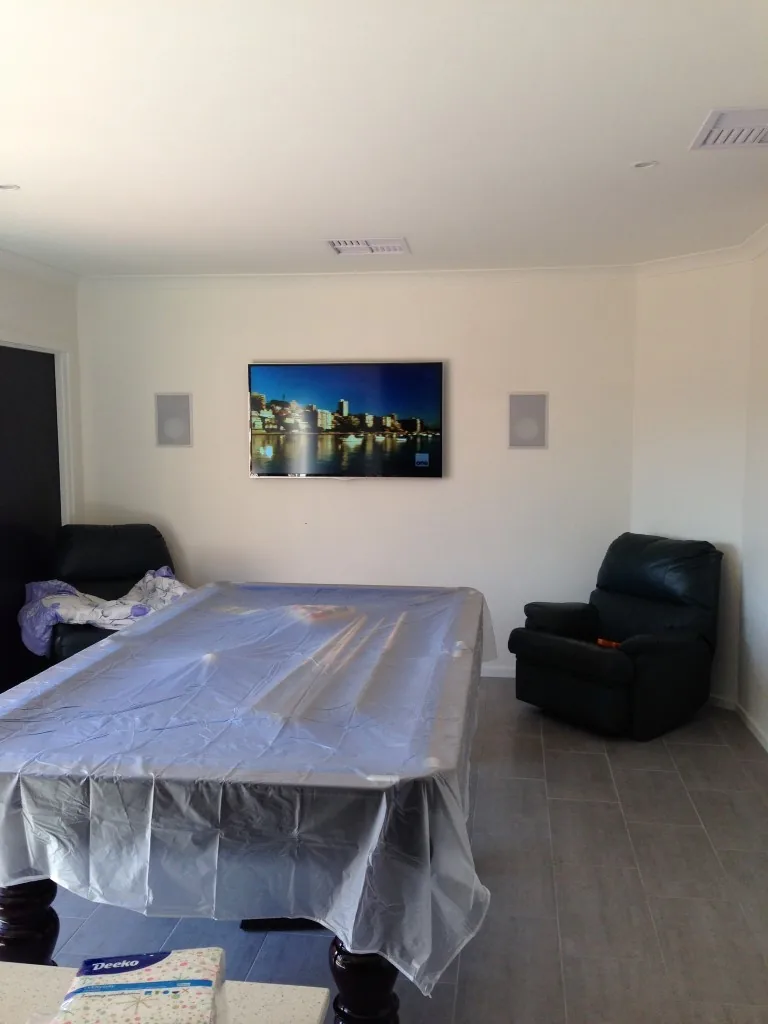 In-wall speakers with wall-mounted TV